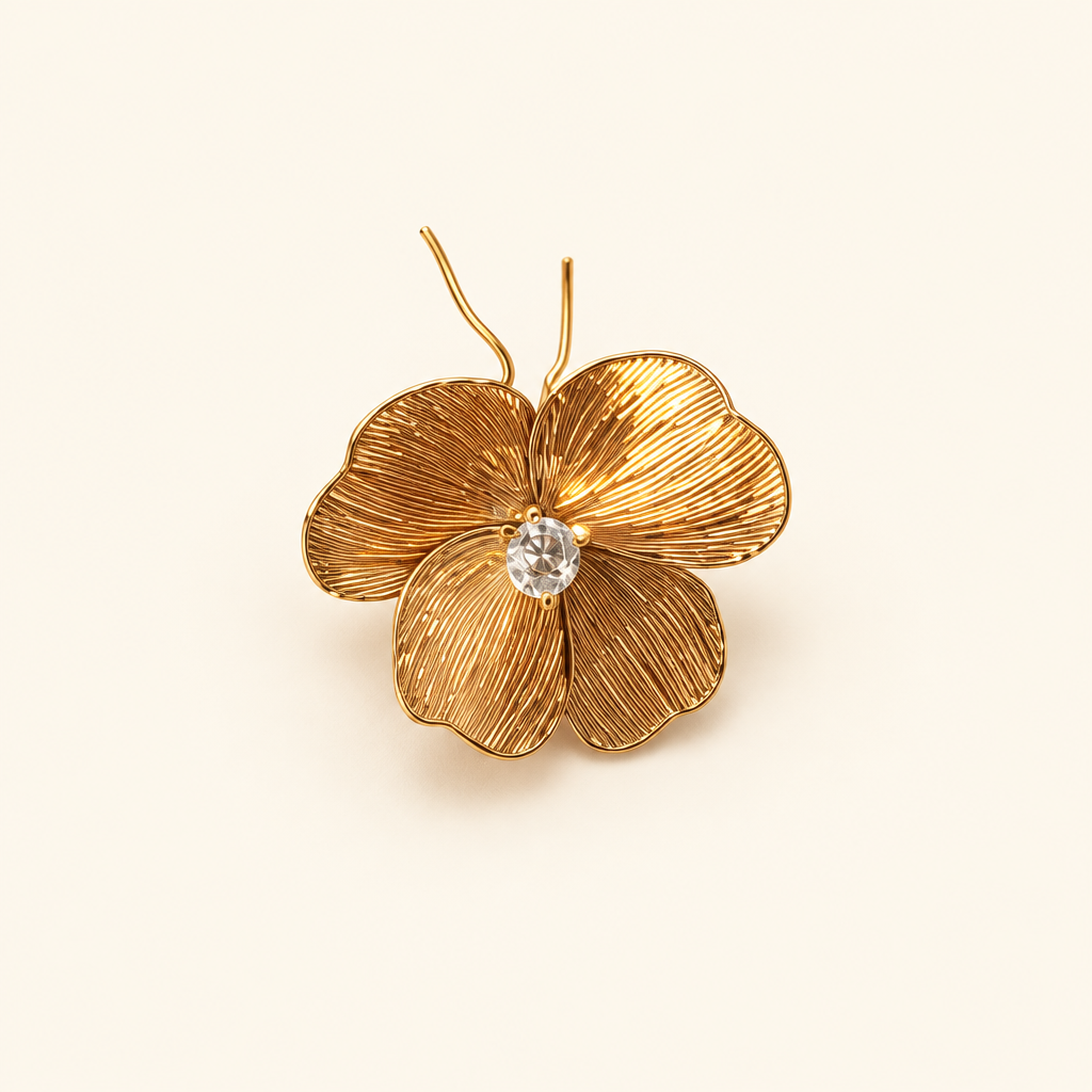 Gold floral ornament on an ivory background
