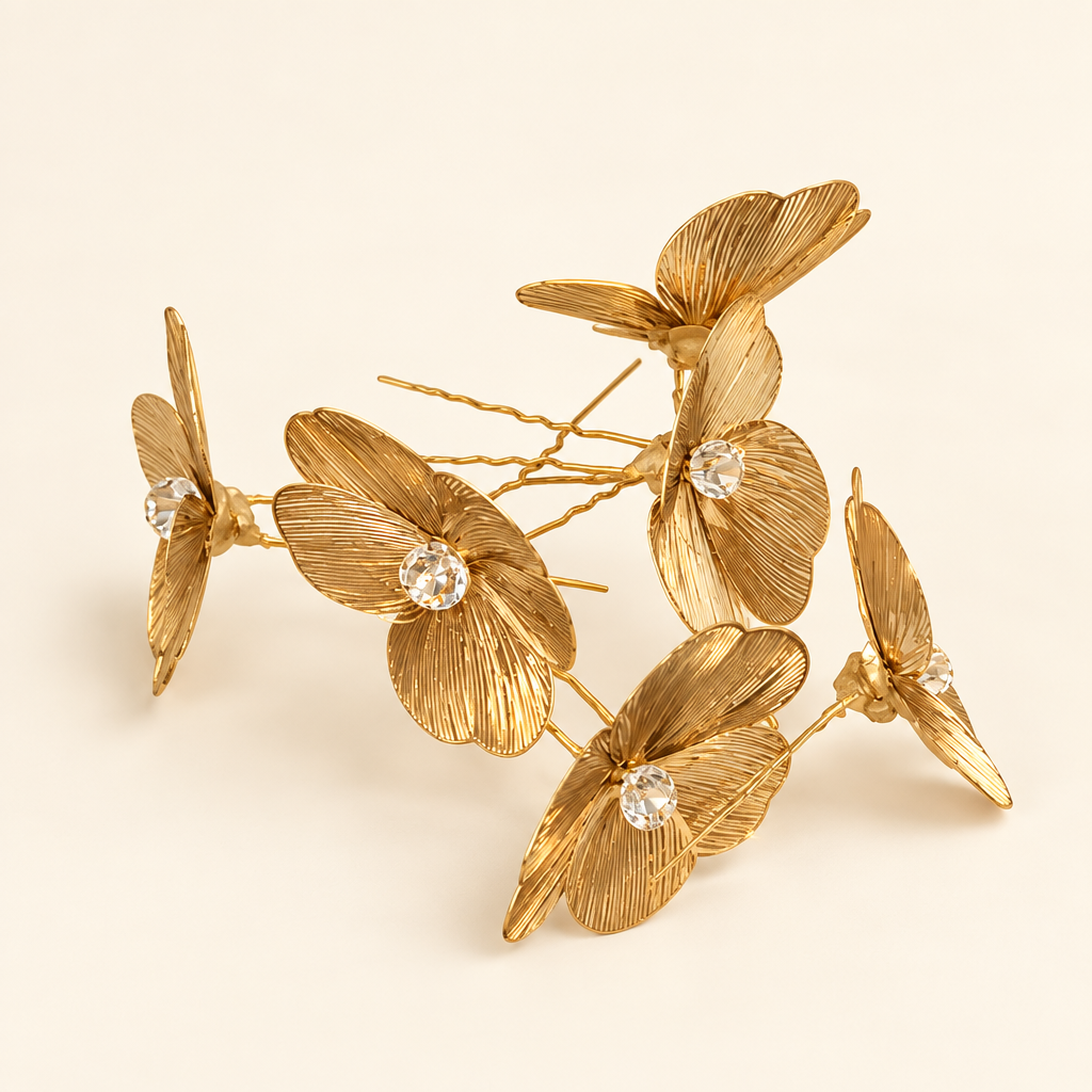 Gold floral pieces on an ivory background