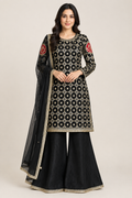 Model wearing the black embroidered outfit