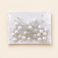 Pearl sprays on a warm ivory background