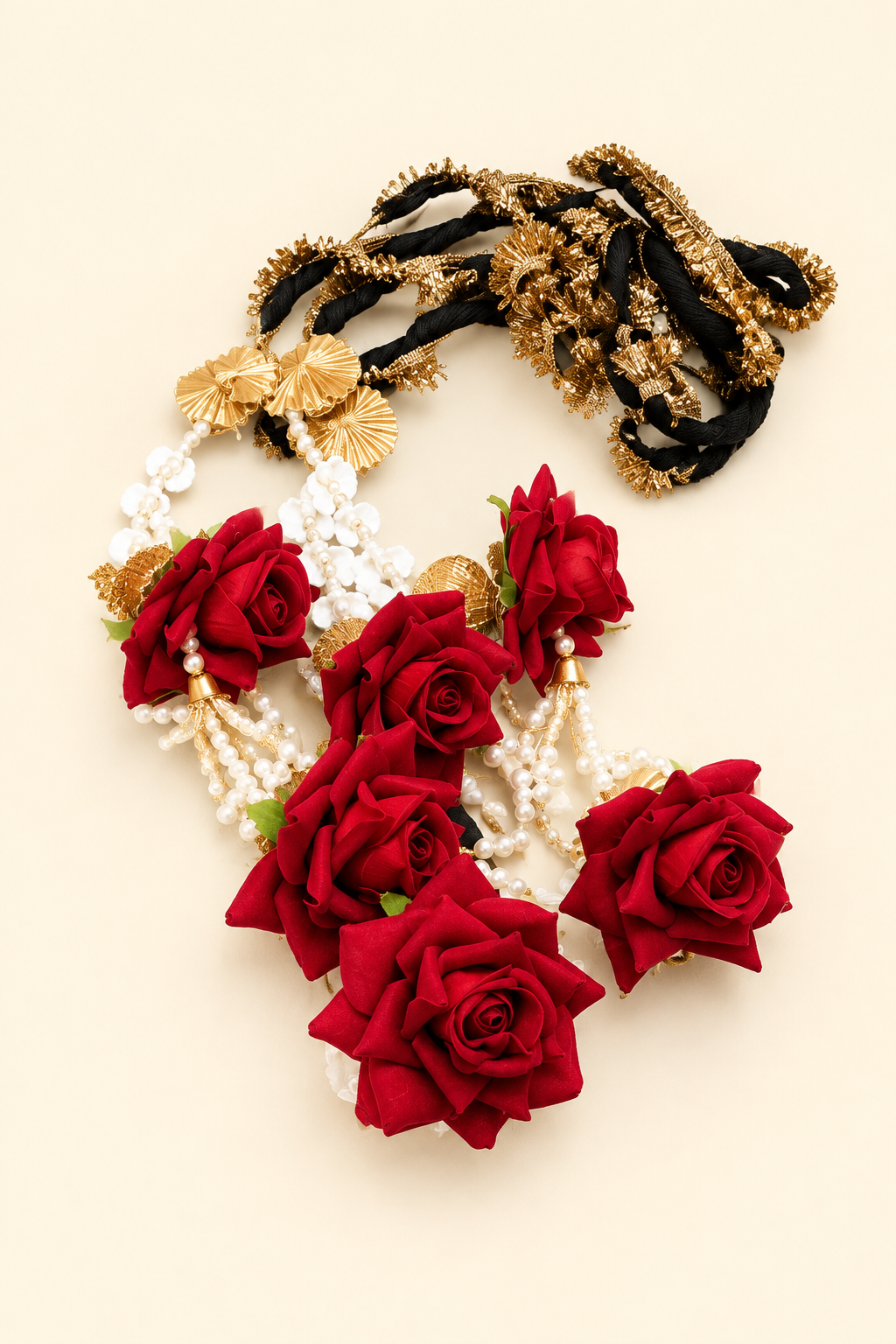 Red floral accessory on an ivory background